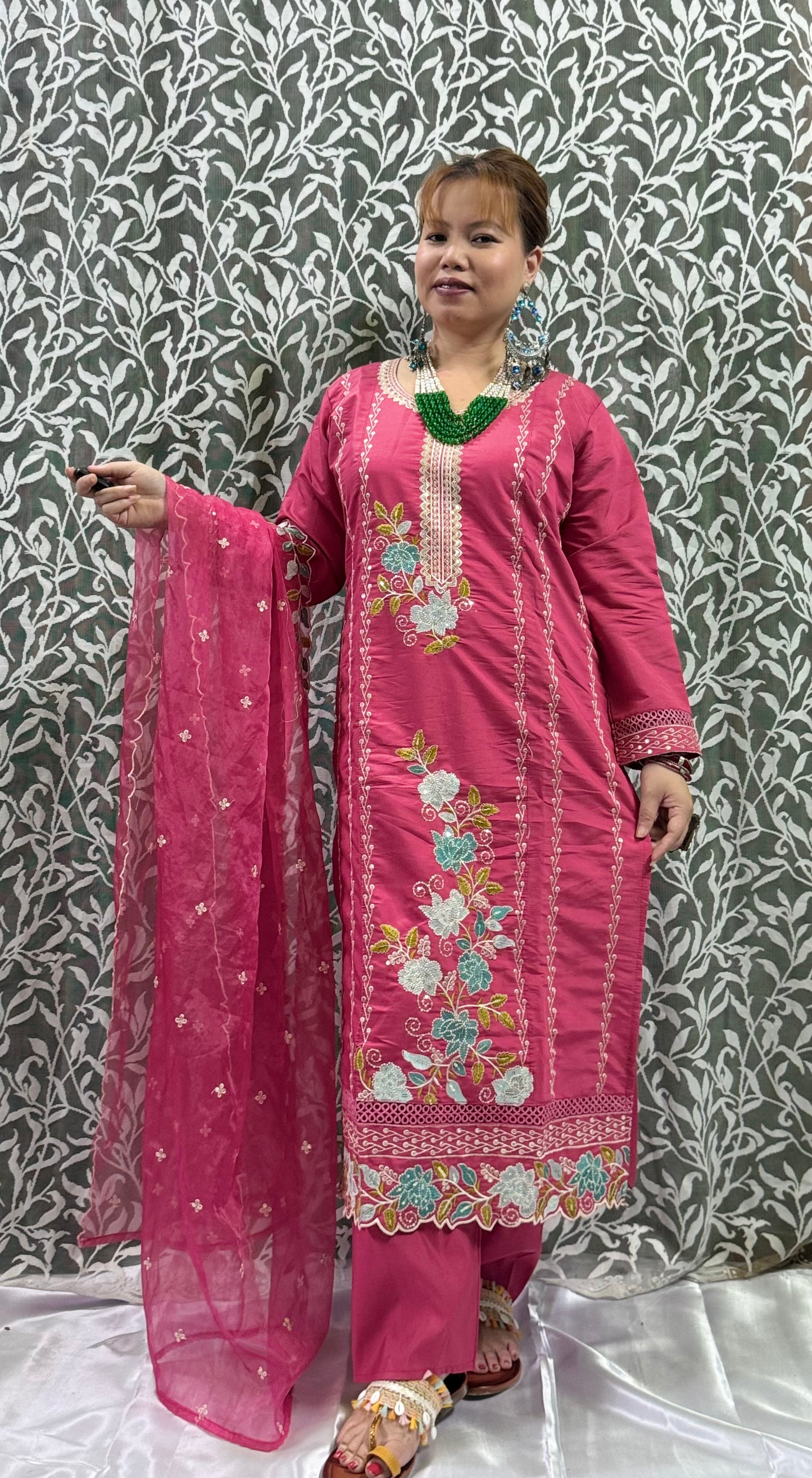 Color Combination:
• Kurta & Pants: Bright Rose Pink
• Embroidery: Multicolor floral motifs in aqua blue, white, yellow-green, and light pink
• Dupatta: Soft net in matching pink with delicate floral embr